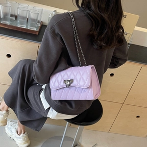 Lavender quilted chain crossbody bag with rhombus pattern and metal twist lock