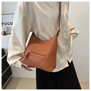 Caramel brown hobo tote bag with lychee texture and decorative zipper pocket detail