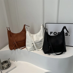 Minimalist large capacity hobo tote bag in brown, white, and black colors on display