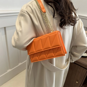 Fashionable bright orange quilted crossbody bag with gold chain strap for women