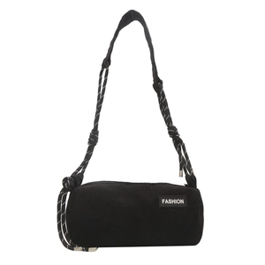 Black corduroy cylindrical crossbody bag featuring a fashion tag and braided shoulder strap