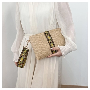 Straw envelope clutch bag with ethnic floral wristlet and refined woven texture