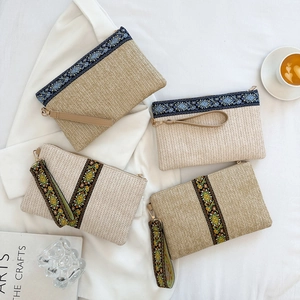 Ethnic straw clutch bags with bohemian floral embroidery and wrist straps for summer beach