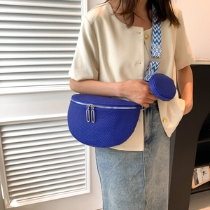Navy blue bubble leather crescent waist bag with geometric patterned wide strap