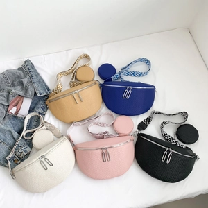 Fashionable crescent saddle bags in five colors with woven guitar straps and coin purses