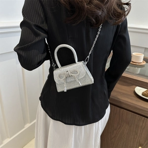 Silver sequin mini handbag with rhinestone bow and metal chain strap for women