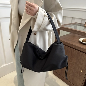 Minimalist black oversized hobo shoulder bag for women made of soft nylon fabric