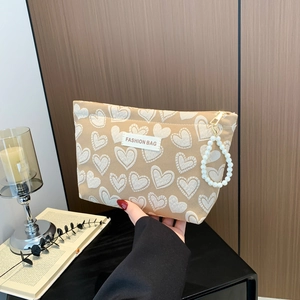 Chic khaki heart-patterned mobile pouch with pearl zipper charm and woven label
