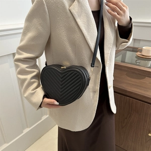 Fashion heart shaped quilted crossbody bag in black leather with gold zipper for women