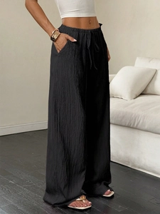 Women's black high waist wide leg trousers with textured fabric and drawstring