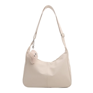 Minimalist cream white tote bag with adjustable strap and cute plush bear charm decoration