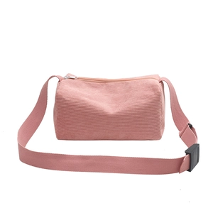 Pink corduroy crossbody pillow bag for women with wide shoulder strap and metal zipper