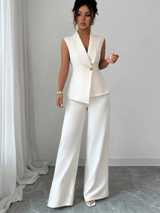 Detail of white two-piece set featuring sleeveless blazer vest and wide-leg trousers