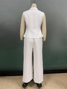 Detail view of a white two-piece set featuring a belted sleeveless vest and wide-leg trousers