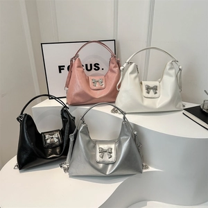 Sleek large capacity hobo bags in pink, white, black and silver with metal bow details