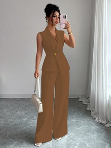 Detail of warm brown two-piece vest suit featuring a wrap top and wide-leg trousers
