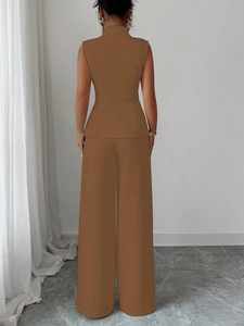 Back view of elegant caramel two-piece set featuring a waist-cinched vest and wide-leg trousers