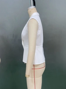 Detailed side view of white sleeveless vest showing tailored waist and woven texture