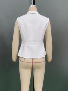 Detail view of white peplum vest back with stand collar and elegant waist pleats