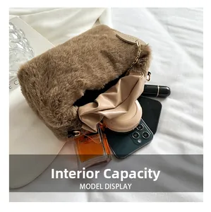 Detail of plush faux fur shoulder bag interior showing capacity for phone and cosmetics