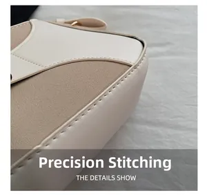 Precision stitching detail on beige faux leather shoulder bag with seamless craftsmanship