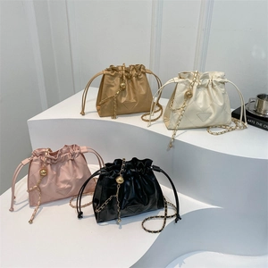 Quilted leather drawstring bucket bags with gold chain straps in four elegant colors