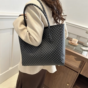 Deep grey tote bag with geometric circle patterns and long handles for shoulder use