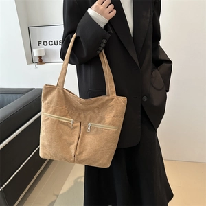 Minimalist corduroy tote bag with dual zipper pockets for stylish daily commuting use