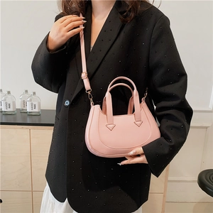 Pink minimalist U-shaped PU leather handbag with adjustable strap and gold hardware