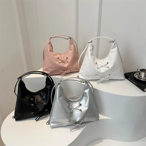 Chic multi-color hobo tote bags in black, pink, white, and silver with lace-up detail