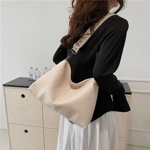 Urban chic beige hobo bag with ethnic jacquard strap for fashionable daily commuting