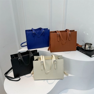 Classic textured tote bag in four colors with dual handles and long shoulder straps