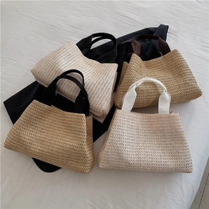 Handwoven straw tote bags for women in cream and beige colors with stylish fabric handles