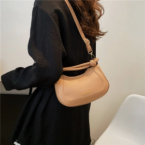 Khaki crescent crossbody bag with FASHION & BAGS print and adjustable knot strap