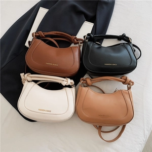 Fashionable minimalist saddle handbag set in black, brown, khaki, and cream leather colors