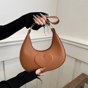 Chic brown crescent handbag with heart embossing and golden hardware for women
