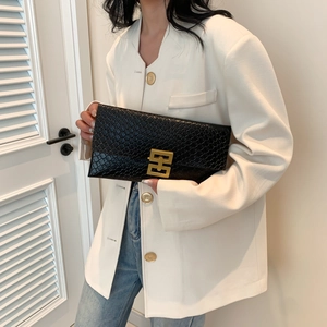 Minimalist black faux-crocodile leather envelope clutch with a gold geometric clasp