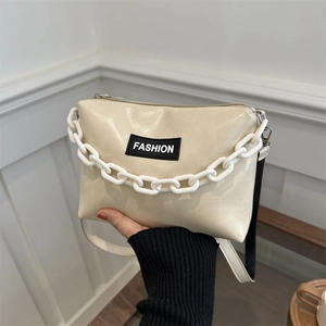 Chic cream white faux leather shoulder bag with fashion patch and bold chain strap