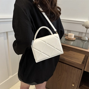 Chic quilted beige crossbody bag with top handle and adjustable strap for women