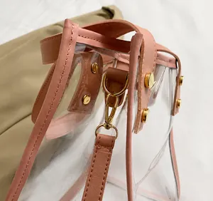 Close-up of pink faux leather trim and precision stitching on a transparent PVC beach bag