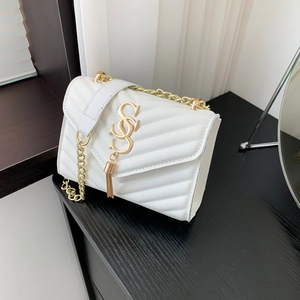 Chic white quilted shoulder bag with gold chain strap and elegant tassel detail