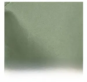 Close-up of olive green canvas fabric texture showing fine weave and premium smooth finish