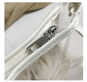 Close-up of the high-quality silver metal zipper detail on a white jelly beach bag