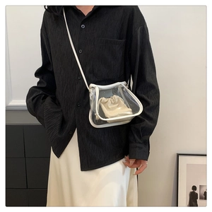 Detail of transparent PVC crossbody bag with white leather trim and inner drawstring pouch