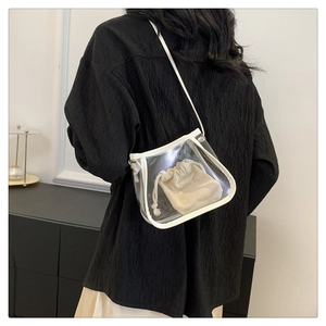 Transparent PVC bucket bag detail with white PU leather trim and canvas drawstring liner