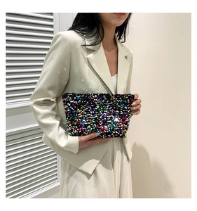 Close-up of colorful sequins on stylish handheld fashion pouch for women