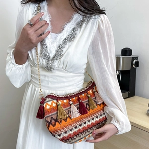 Ethnic style crossbody bag with geometric embroidery, colorful tassels and gold chain