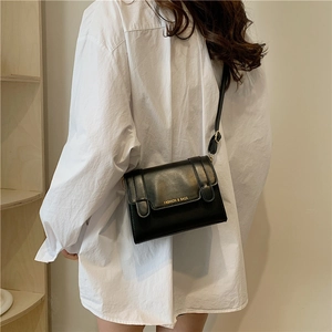 Chic black leather small square bag with gold FASHION & BAGS text and slim shoulder strap