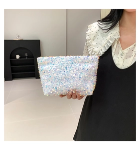 Close-up of a stylish sequin handbag featuring colorful iridescent round sequins