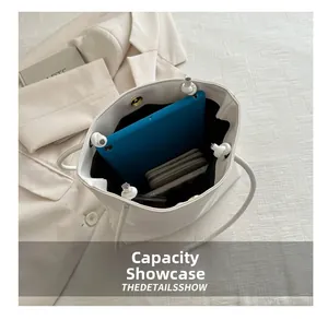 Interior view showing the large capacity of the white tote bag with daily essentials